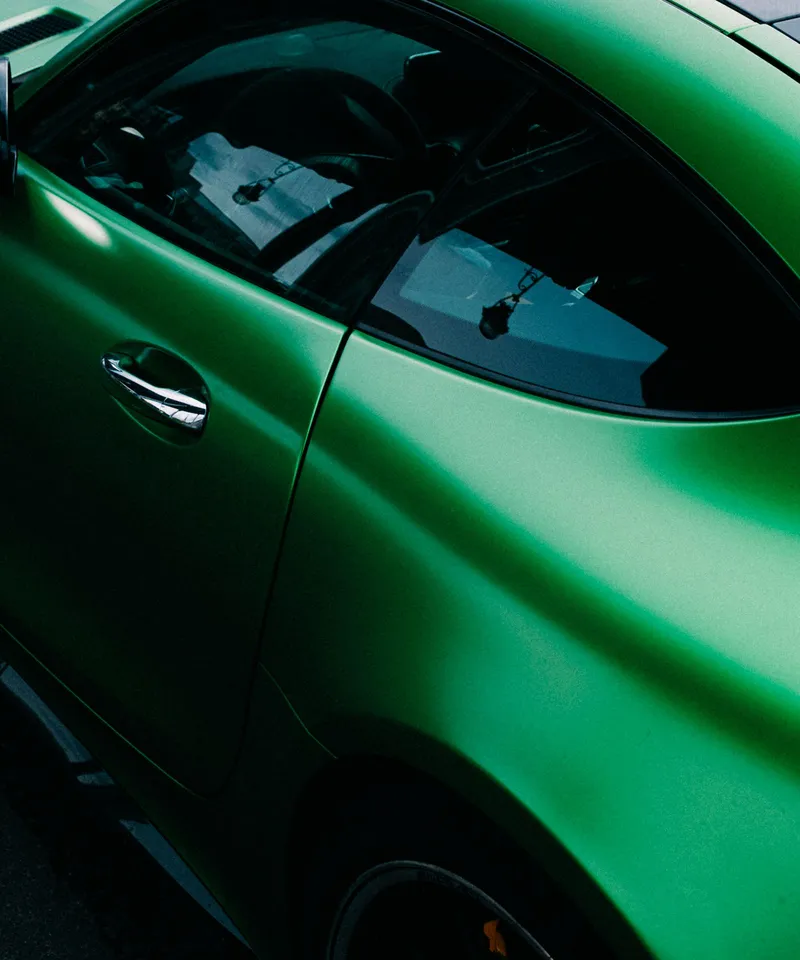 Green satin-finish sports car door and window